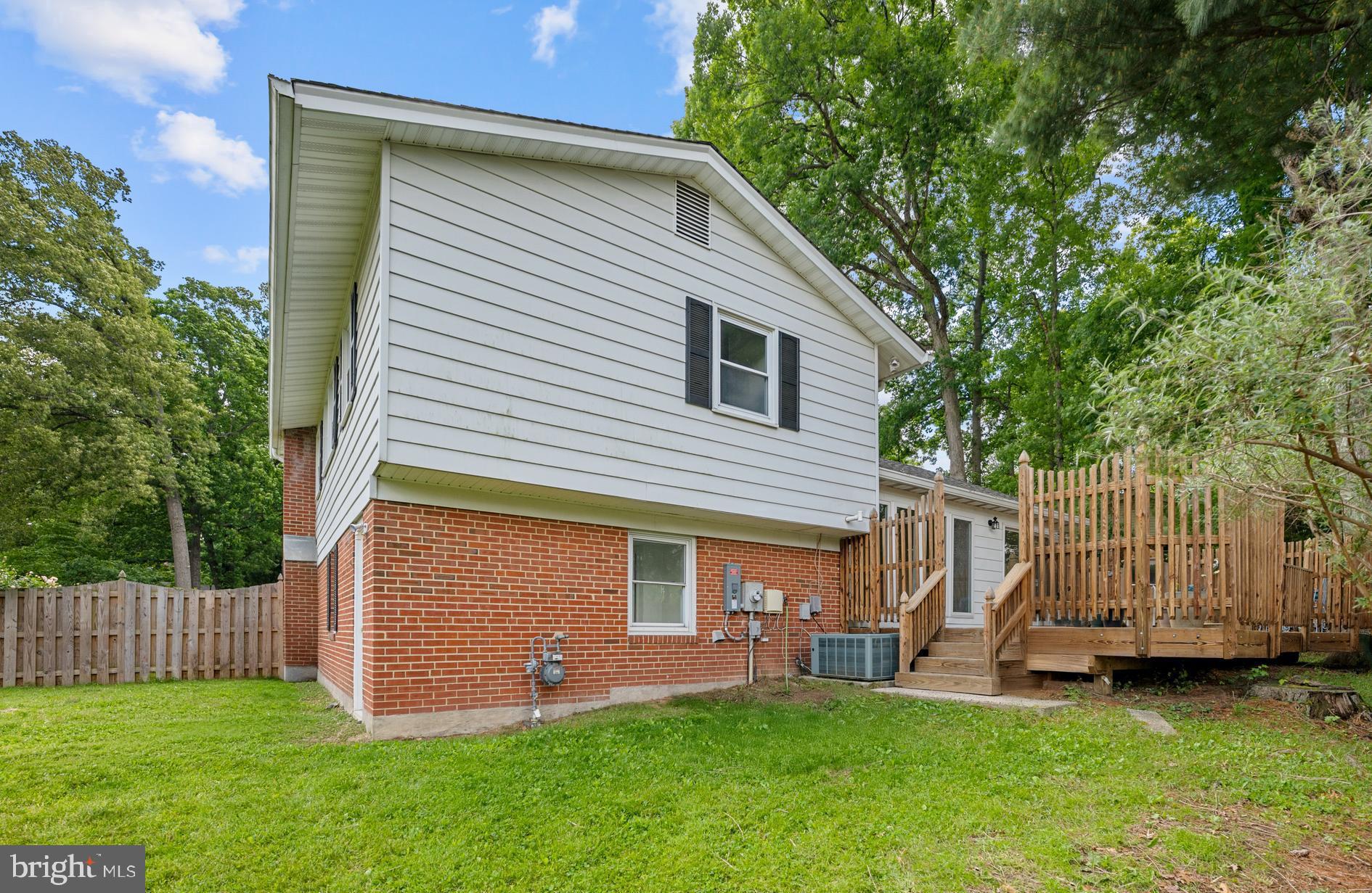 6800 Seton Court Springfield, VA 22152 - Photo 43 of 51 front view of a house with a yard