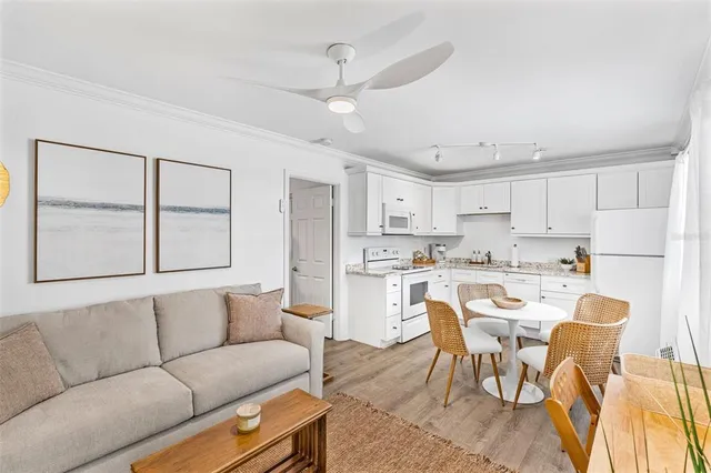 a bedroom with a large bed and a painting on the wall