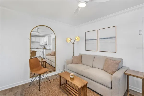 a bedroom with a bed and a mirror