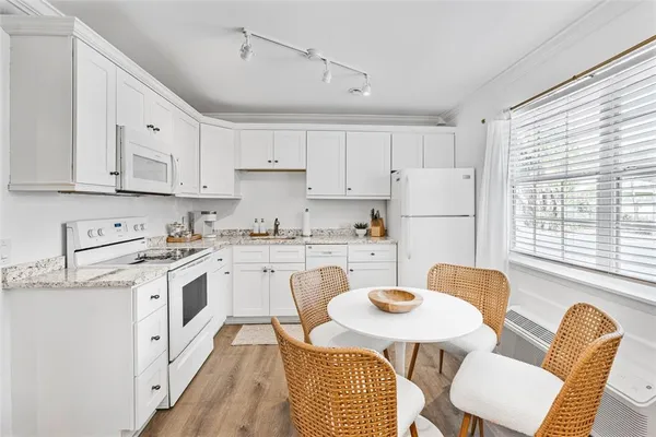 a view of a balcony with wooden floor