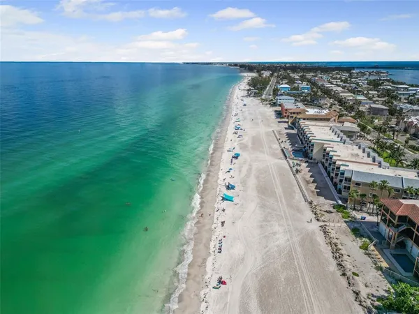 a living room with furniture a rug and a flat screen tv