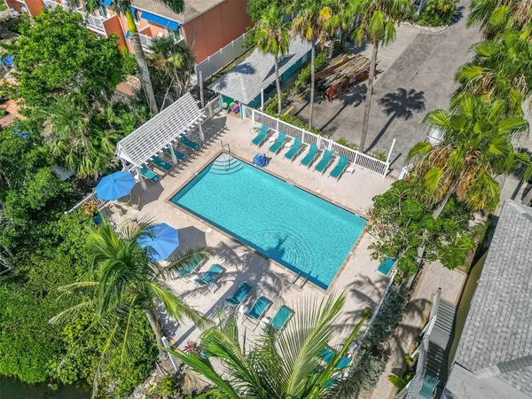 a living room with stainless steel appliances kitchen island granite countertop furniture and a kitchen view