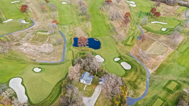 a bathroom with a sink mirror and toilet