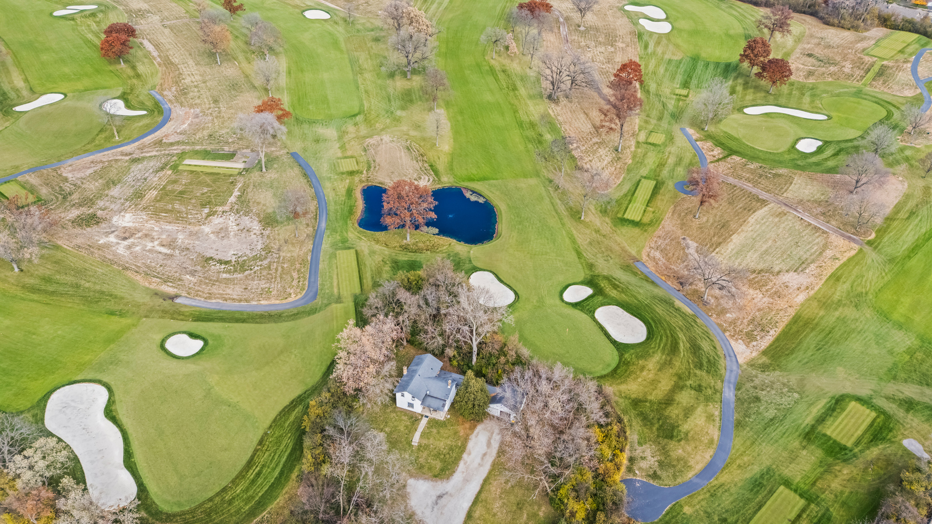 a bathroom with a sink mirror and toilet