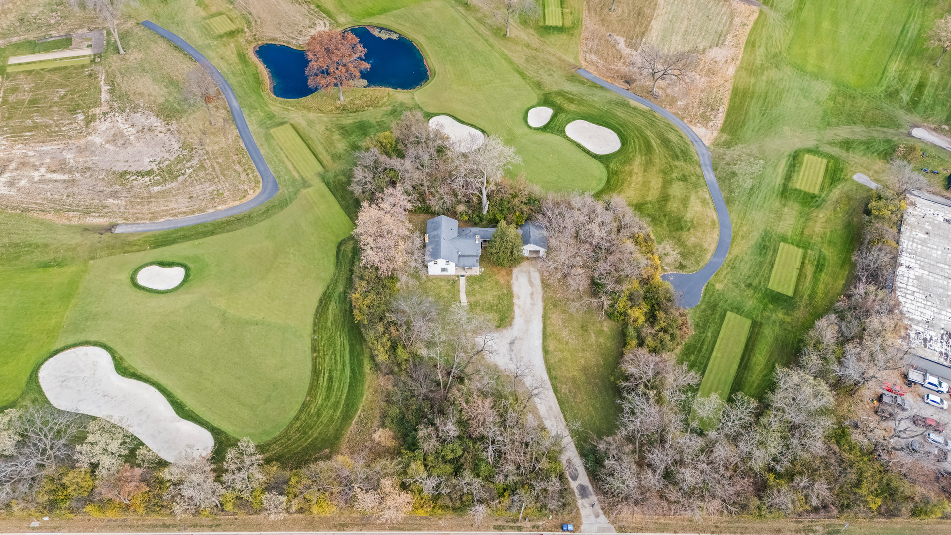 215 Waukegan Road Deerfield, IL 60015 - Photo 2 of 5 a bathroom with a sink mirror and painting on the wall