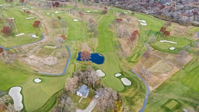 a bathroom with a sink mirror and bathtub