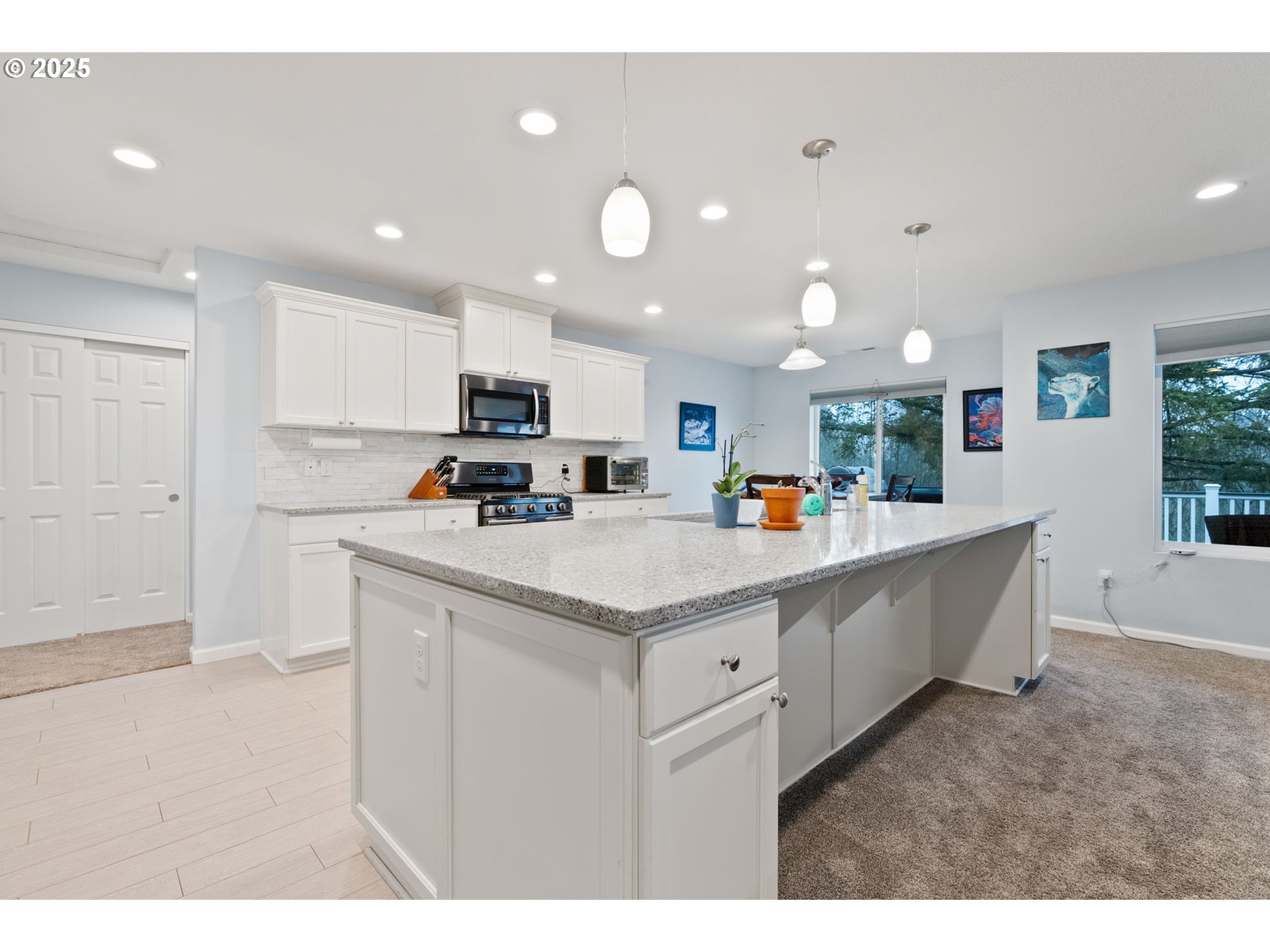 10360 Skyview Road Tillamook, OR 97141 - Photo 12 of 47 a living room with stainless steel appliances kitchen island granite countertop a sink and cabinets