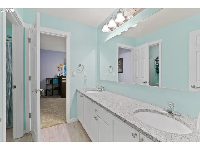 a bathroom with a sink a vanity and a mirror