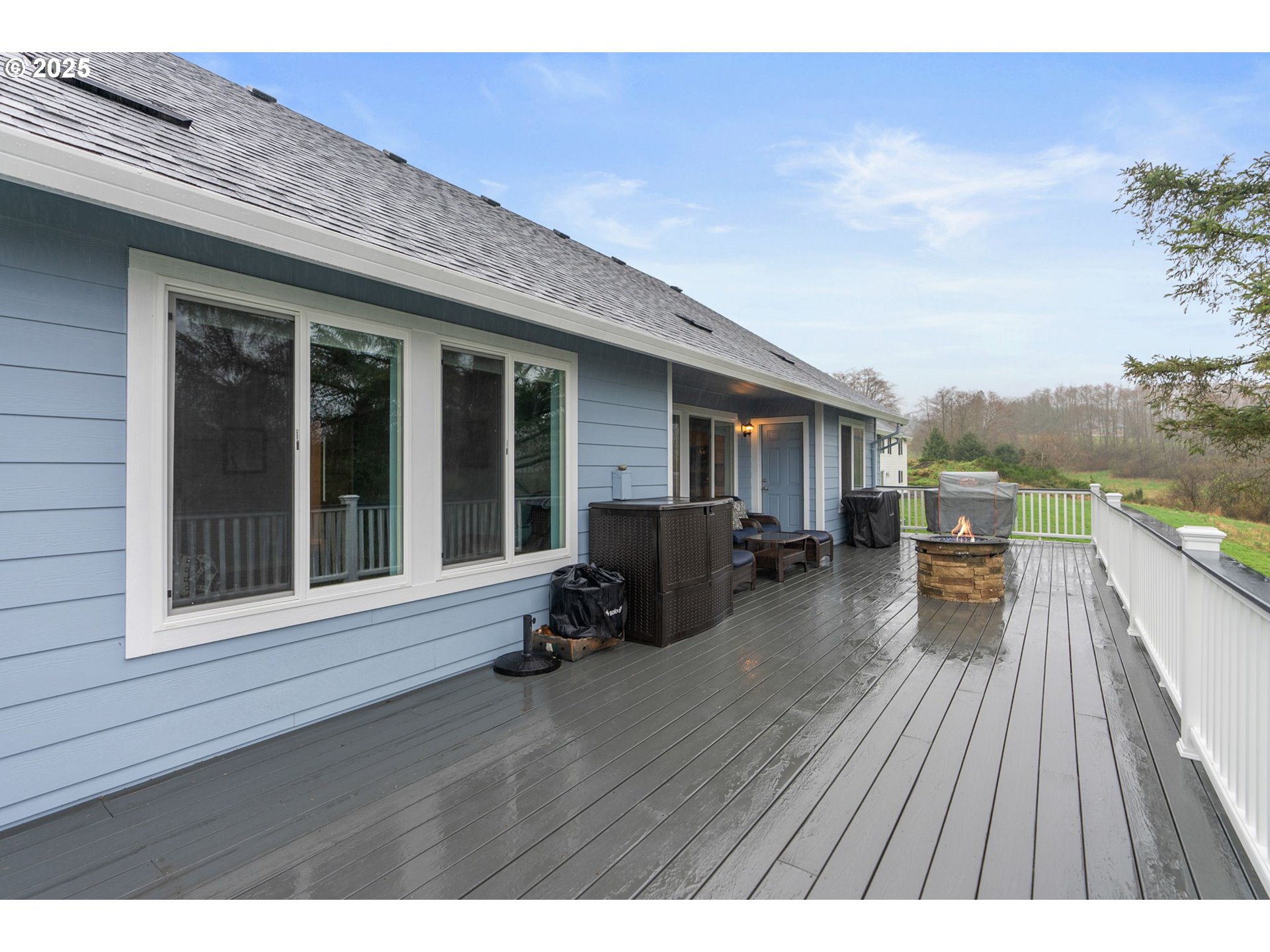10360 Skyview Road Tillamook, OR 97141 - Photo 33 of 47 a view of a deck with wooden floor and barbeque oven