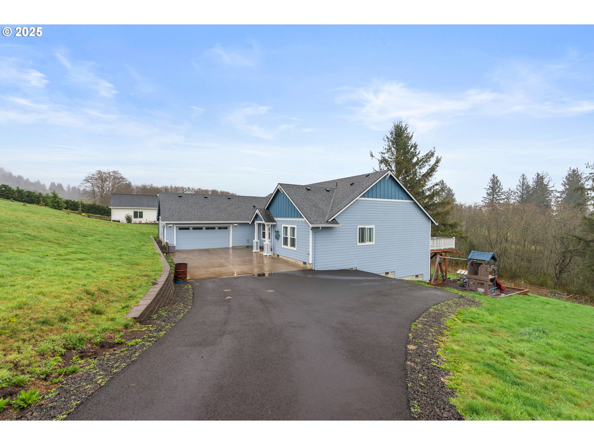 10360 Skyview Road Tillamook, OR 97141 - Photo 4 of 47 a view of house with backyard and garden
