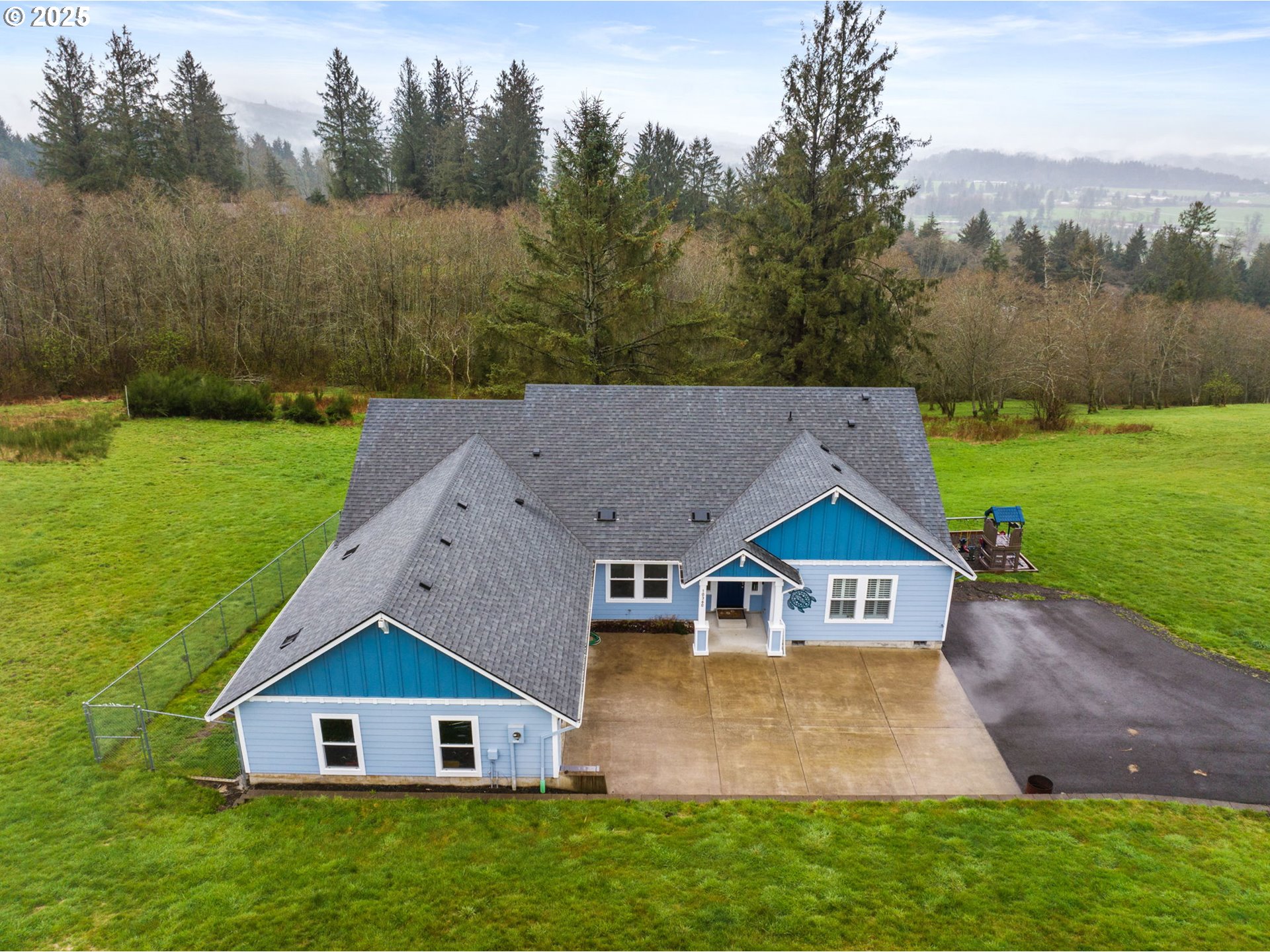 10360 Skyview Road Tillamook, OR 97141 - Photo 42 of 47 an aerial view of residential house with green yard