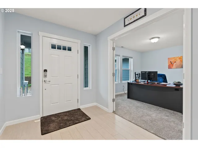 a living room with a couch and a dresser
