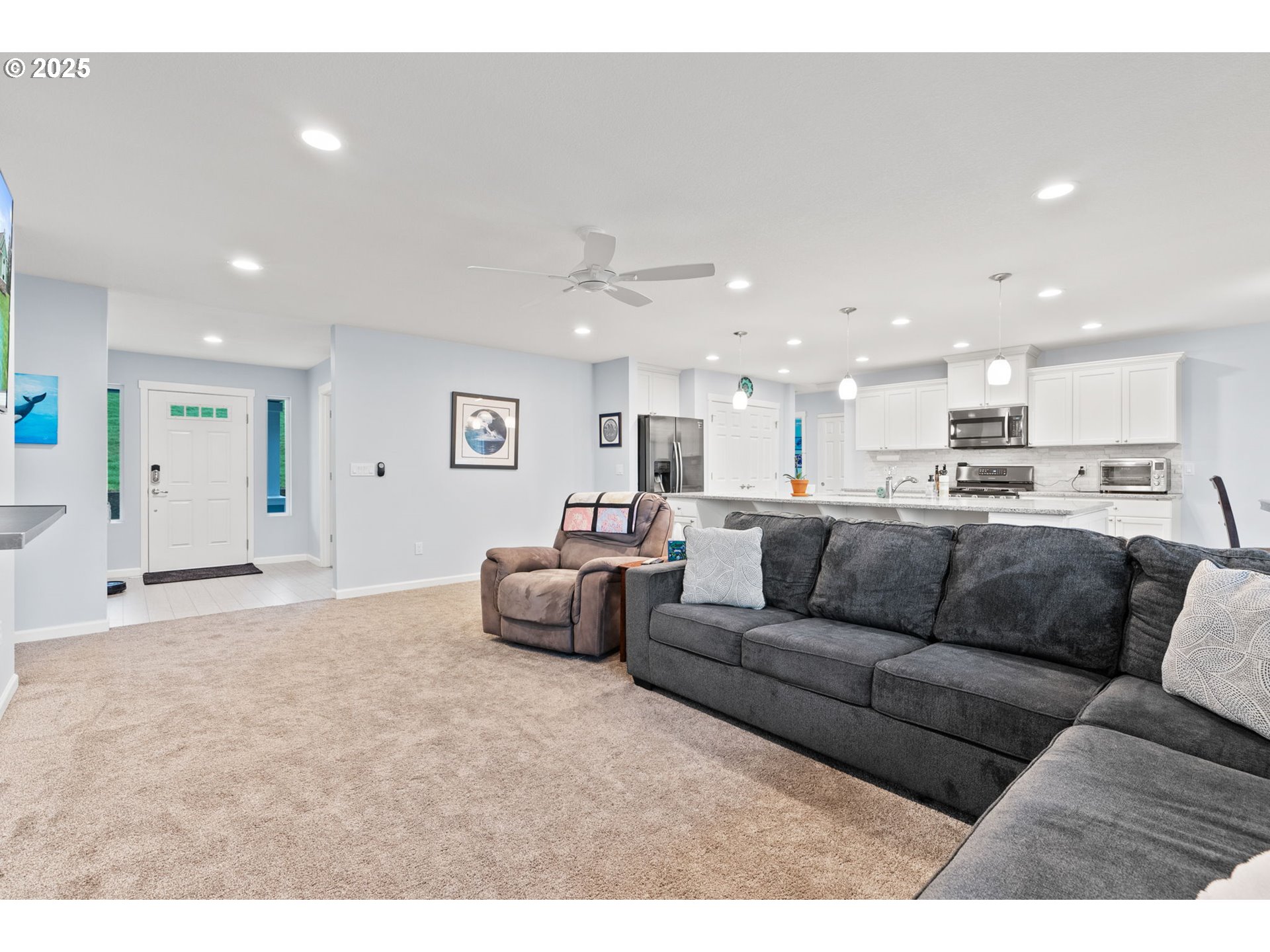 10360 Skyview Road Tillamook, OR 97141 - Photo 10 of 47 a living room with furniture and kitchen view