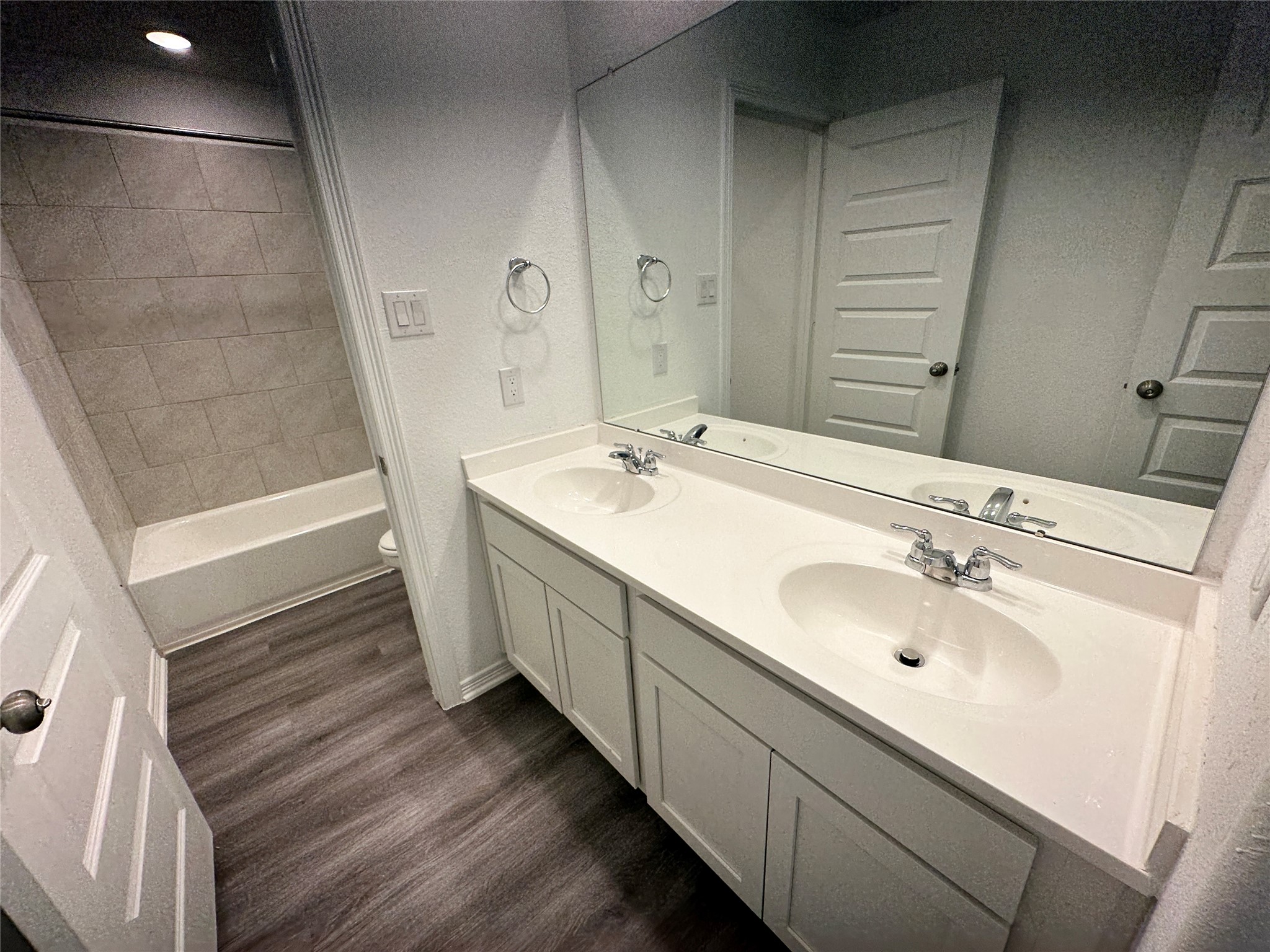 16622 Moss Lane Porter, TX 77365 - Photo 12 of 18 a bathroom with a double vanity sink and a mirror