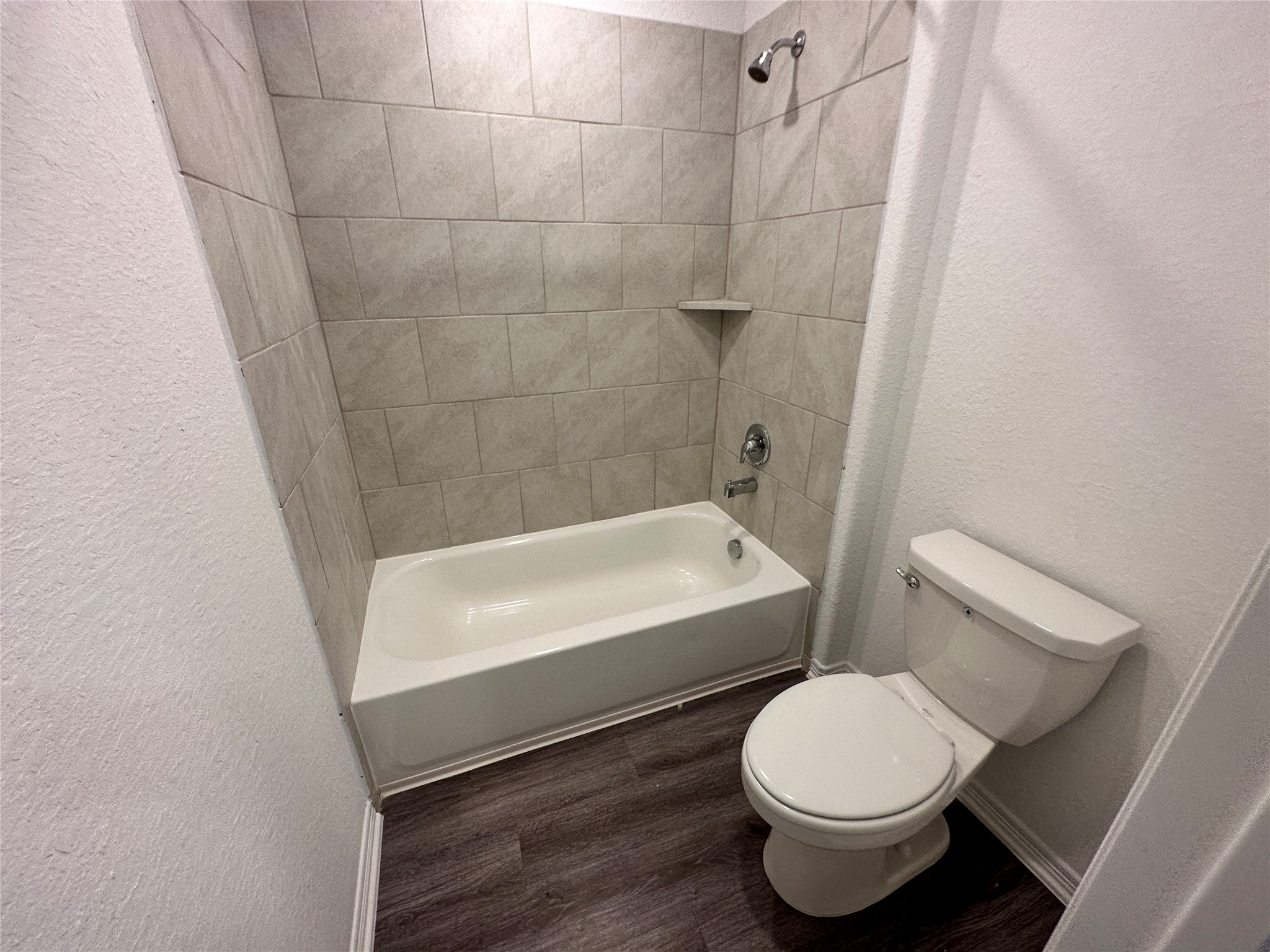 16622 Moss Lane Porter, TX 77365 - Photo 13 of 18 a bathroom with a bathtub and toilet