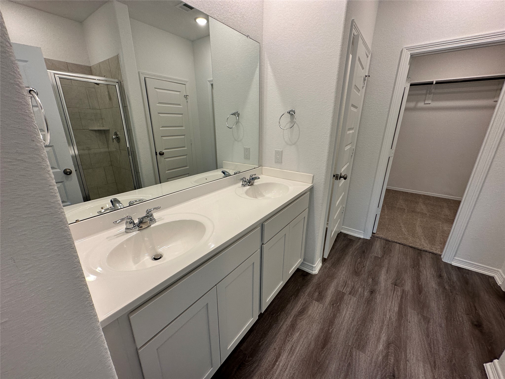 16622 Moss Lane Porter, TX 77365 - Photo 6 of 18 a bathroom with a double vanity sink and mirror