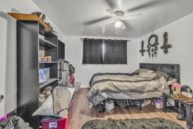 a bedroom with bed and a chandelier