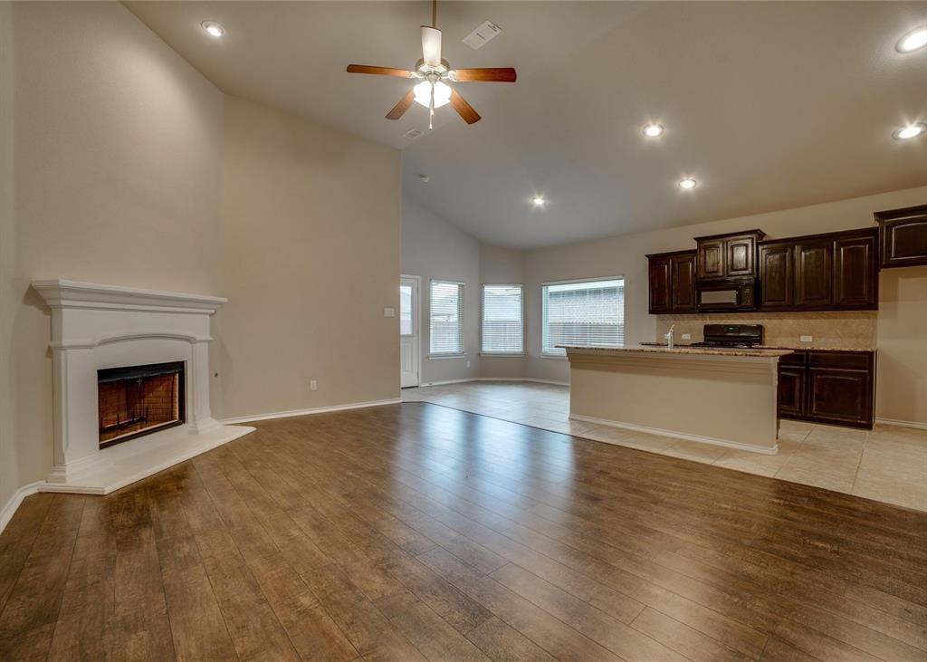 2408 Windhaven Drive Denton, TX 76210 - Photo 2 of 13 a view of kitchen with microwave a stove and a refrigerator