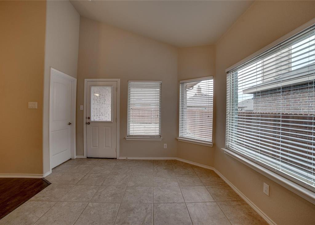 2408 Windhaven Drive Denton, TX 76210 - Photo 5 of 13 a view of an empty room with a window