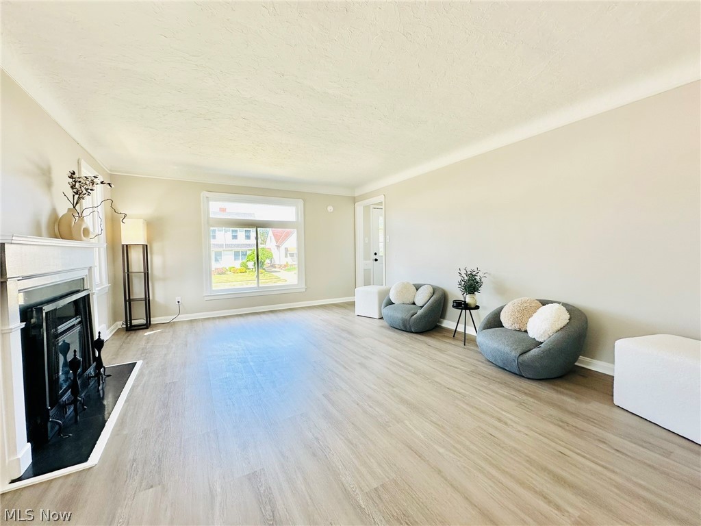 7607 Ridgefield Avenue Cleveland, OH 44129 - Photo 2 of 28 Living room featuring light wood-type flooring