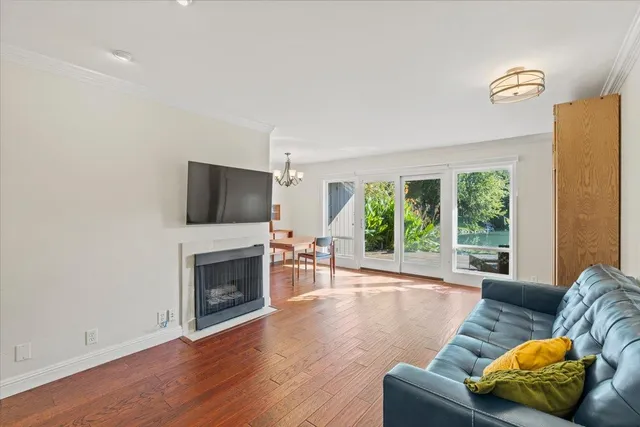 a living room with furniture fireplace and flat screen tv