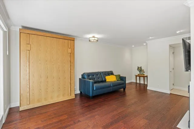 a view of a livingroom with furniture and wooden floor