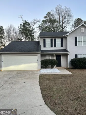 a front view of a house with yard