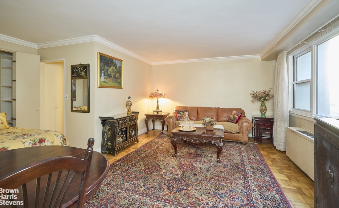 123 East 75th Street, Unit 6A Manhattan, NY 10021 - Photo 1 of 5 a living room with furniture rug and wooden floor