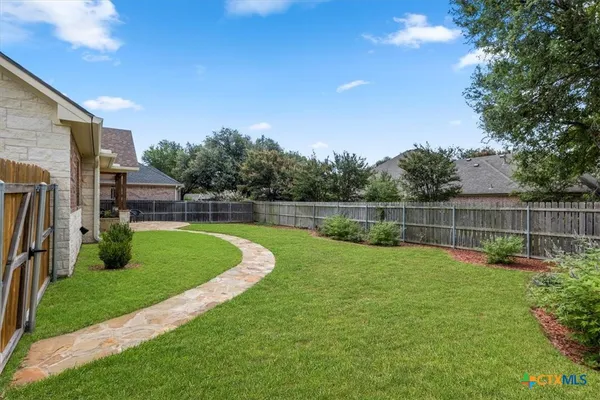 a view of a backyard with a garden