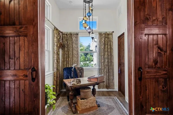 a dining room with furniture window and entryway