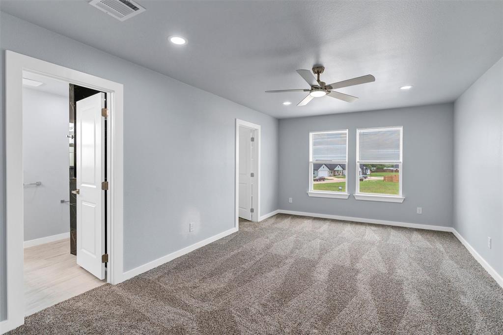 588 Highview Court Godley, TX 76044 - Photo 23 of 38 wooden floor in an empty room with a window