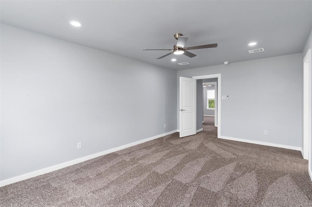 588 Highview Court Godley, TX 76044 - Photo 25 of 38 a view of an empty room with a ceiling fan