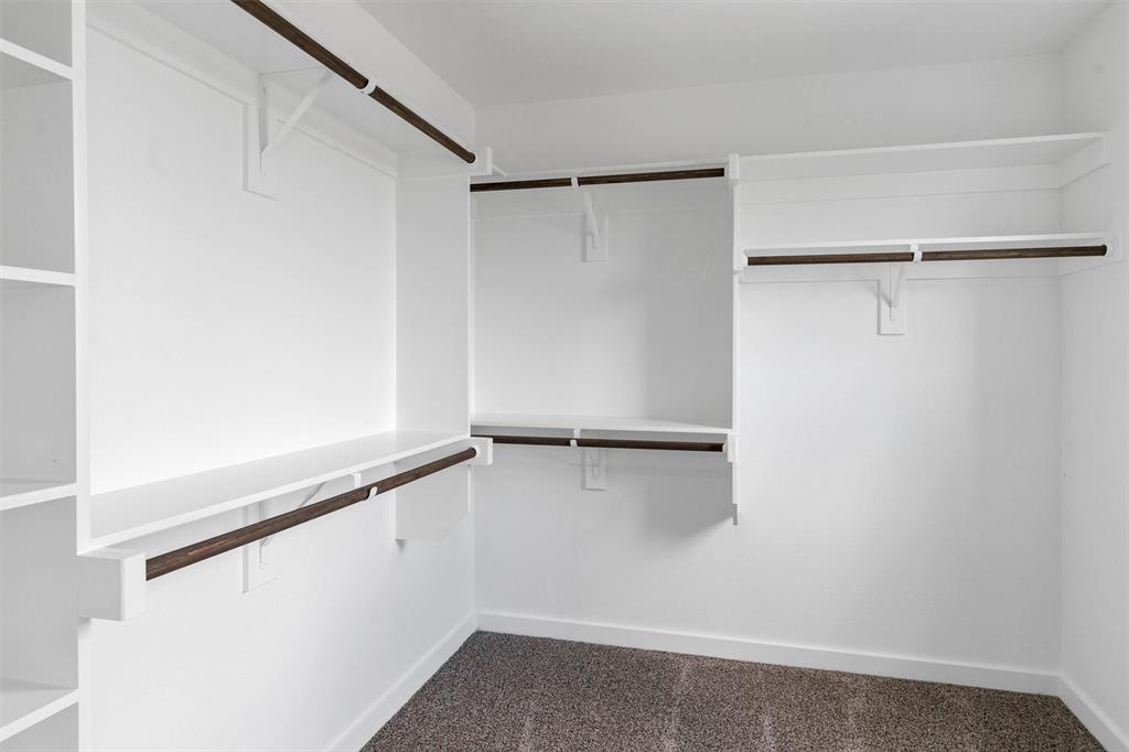 588 Highview Court Godley, TX 76044 - Photo 26 of 38 a view of an empty walk in closet