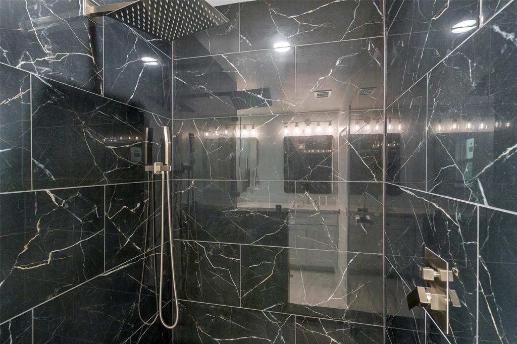 588 Highview Court Godley, TX 76044 - Photo 28 of 38 a bathroom with a glass shower