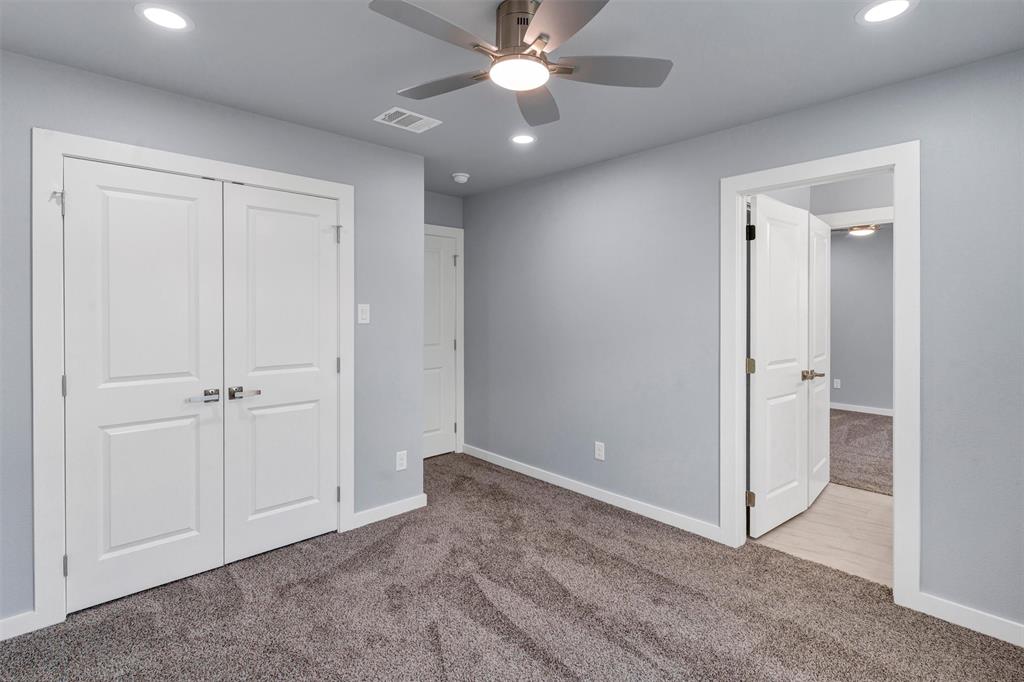 588 Highview Court Godley, TX 76044 - Photo 30 of 38 an empty room with closet and a chandelier fan