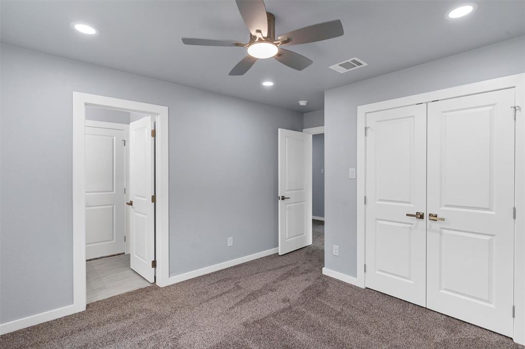 588 Highview Court Godley, TX 76044 - Photo 34 of 38 a view of a livingroom with a ceiling fan & entryway