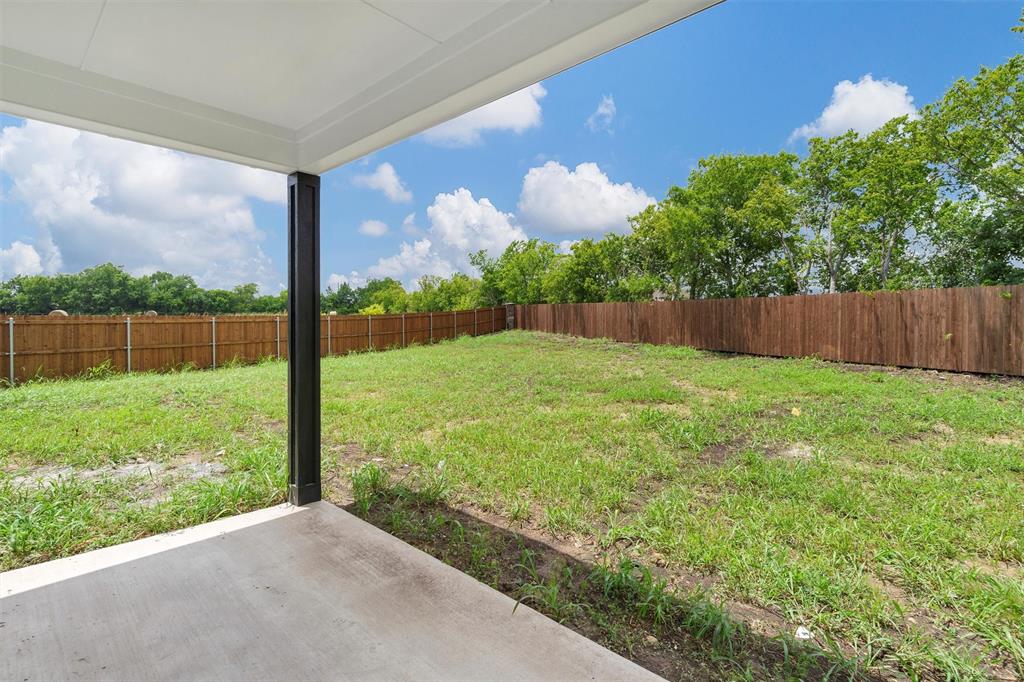 588 Highview Court Godley, TX 76044 - Photo 35 of 38 a view of a back yard from a balcony