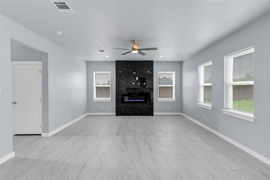588 Highview Court Godley, TX 76044 - Photo 5 of 38 wooden floor in an empty room with a window