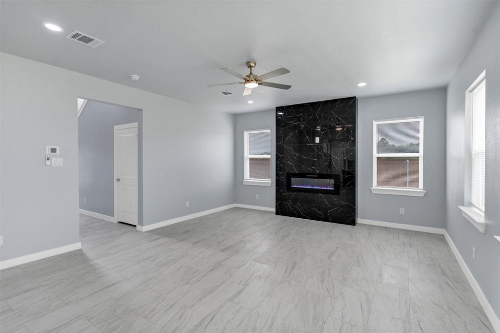 588 Highview Court Godley, TX 76044 - Photo 6 of 38 wooden floor in an empty room with a window