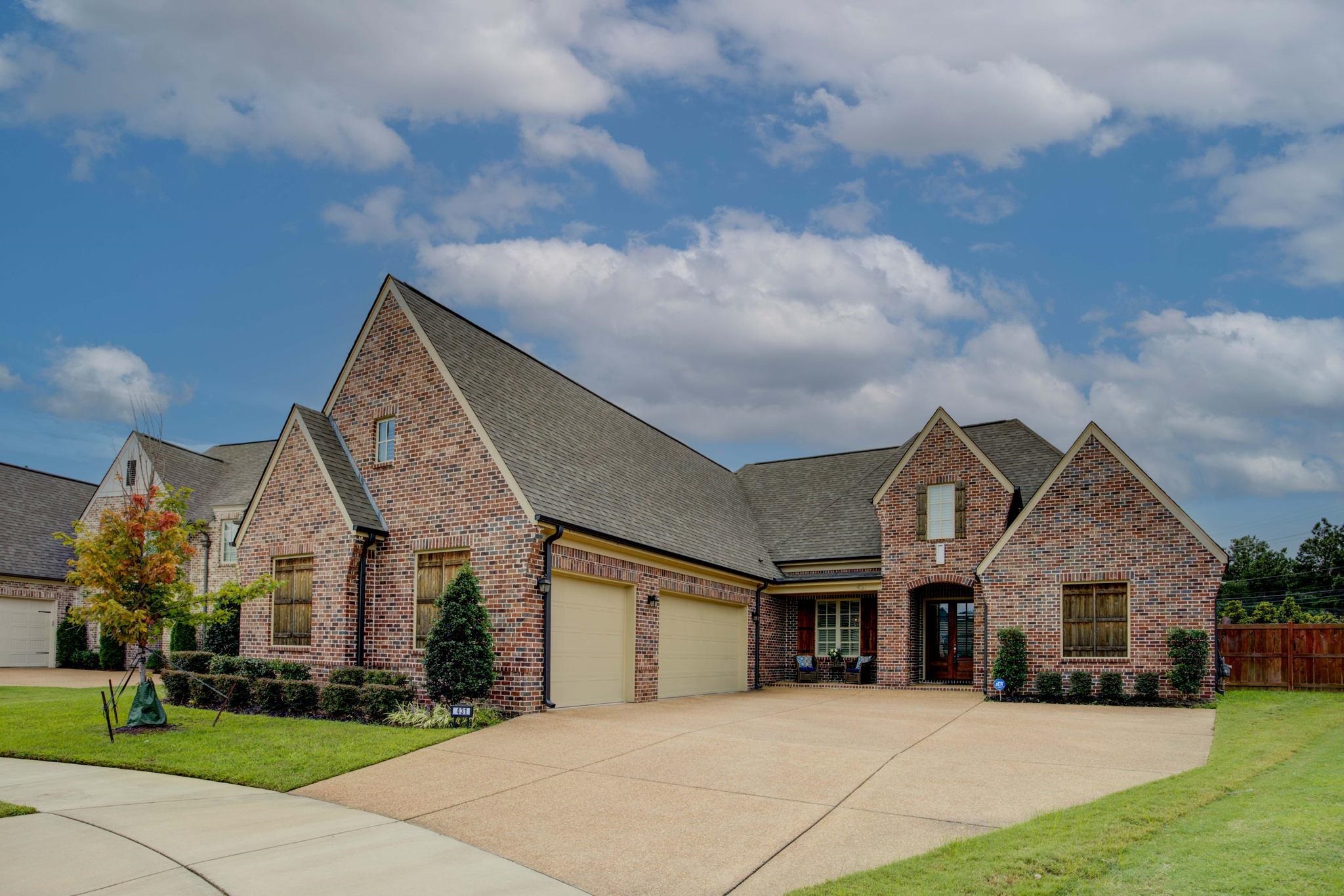 a view of house with yard and entertaining space