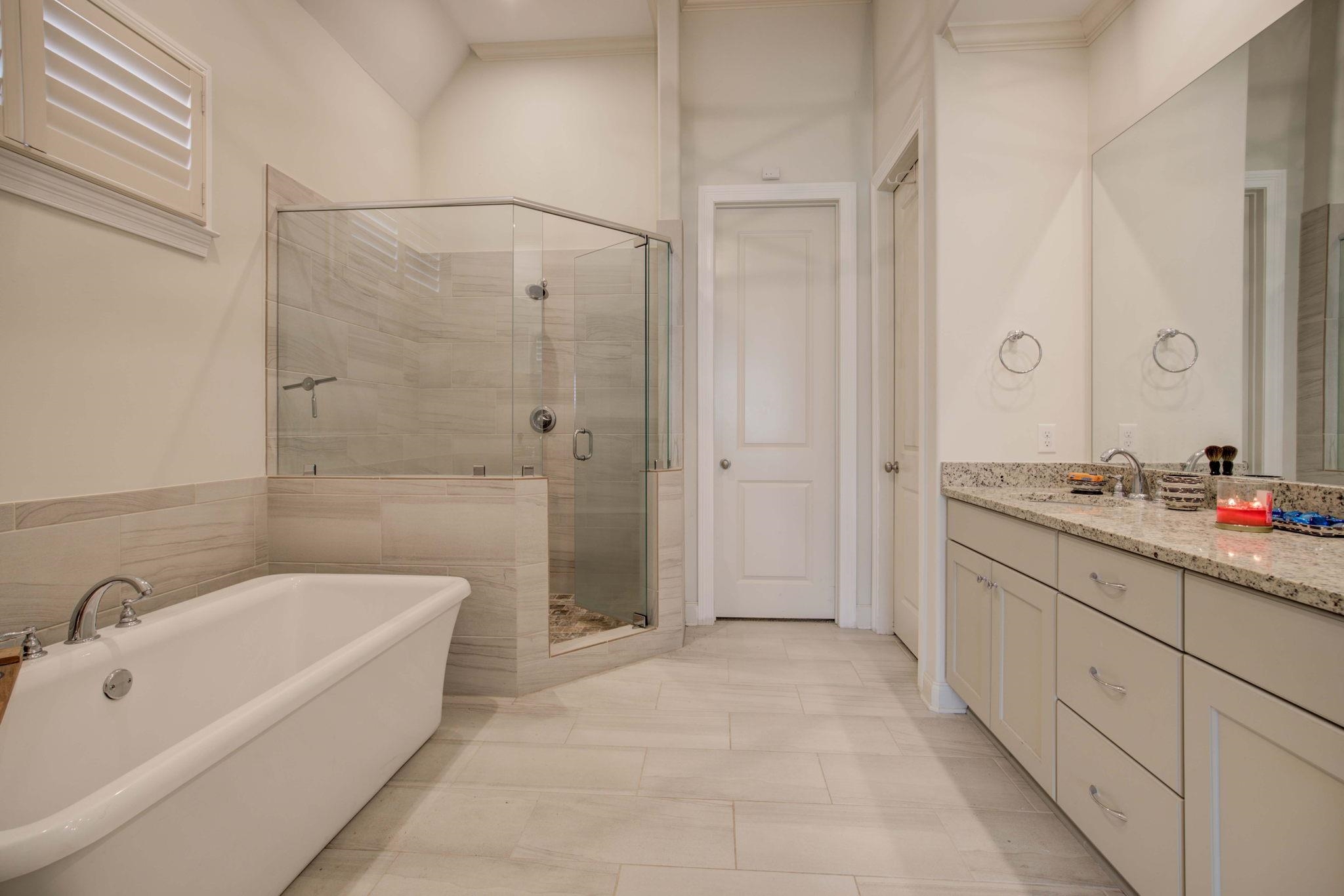 431 Kayley Cove Collierville, TN 38017 - Photo 13 of 24 a spacious bathroom with a tub sink a shower and a mirror