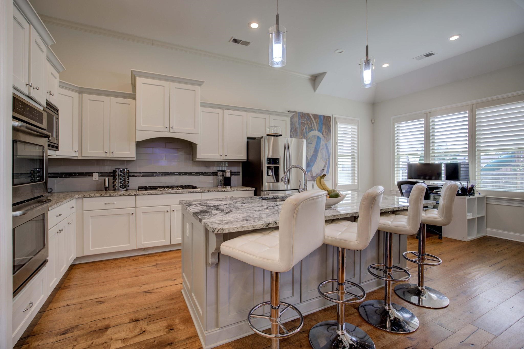 431 Kayley Cove Collierville, TN 38017 - Photo 4 of 24 a kitchen with granite countertop white cabinets and stainless steel appliances
