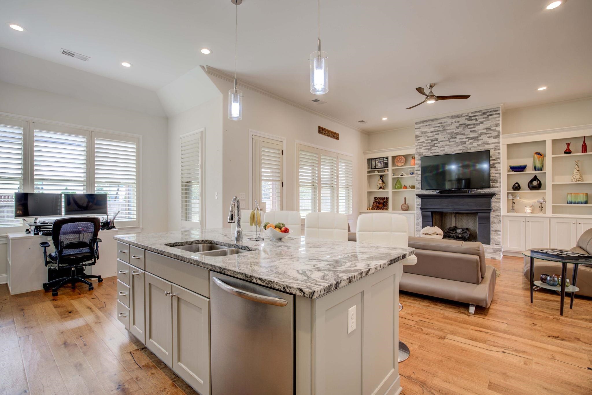 431 Kayley Cove Collierville, TN 38017 - Photo 5 of 24 a view of kitchen island dining table wooden floor and living room