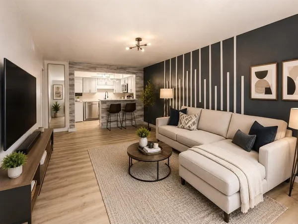 a living room with furniture a large window and a flat screen tv