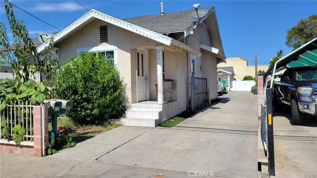 a view of outdoor space and front view of a house