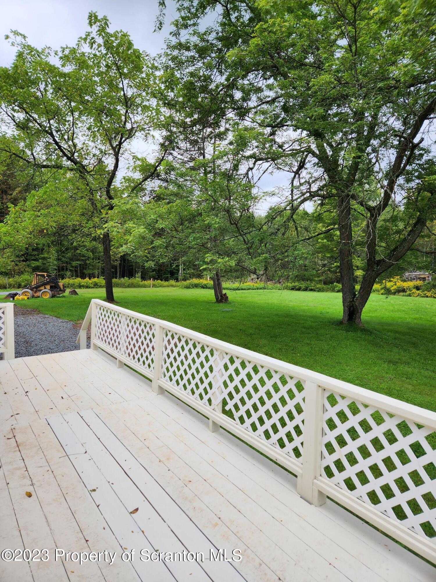 15325 Strickland Hill Road Springville, PA 18844 - Photo 4 of 20 a view of a yard with wooden fence