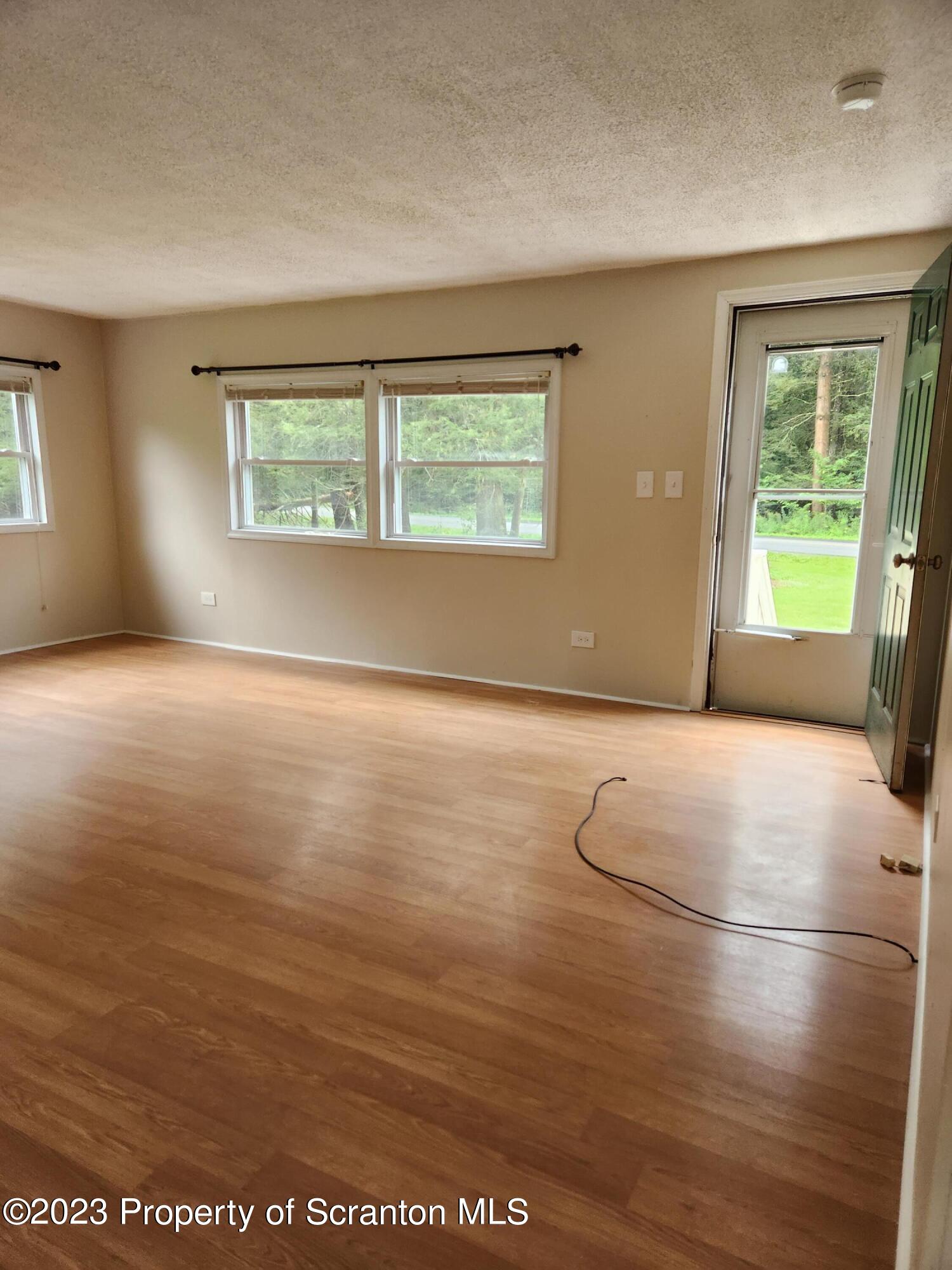 15325 Strickland Hill Road Springville, PA 18844 - Photo 9 of 20 an empty room with windows
