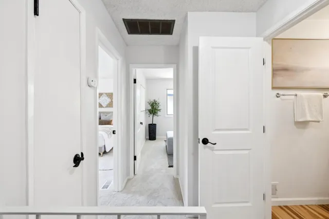 a view of a chair and table in backyard of the house