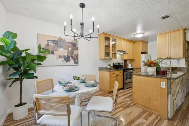 a view of a dining room with furniture window and wooden floor
