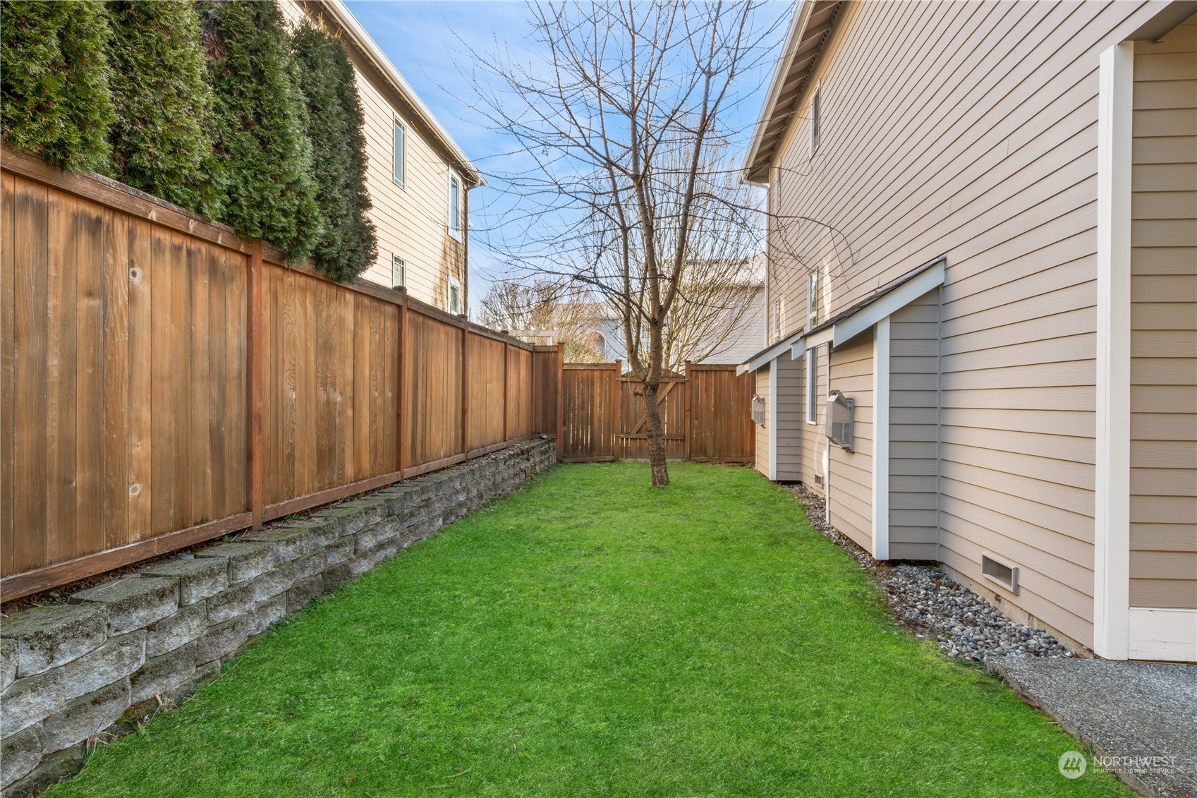 4026 214th Street Southeast Bothell, WA 98021 - Photo 32 of 34 a view of a backyard with wooden fence